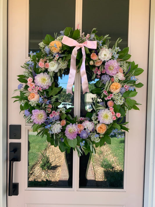 Fresh floral wreath to dress up your front door or celebrate the life of a loved one. Sympathy wreaths available for delivery in Redlands.